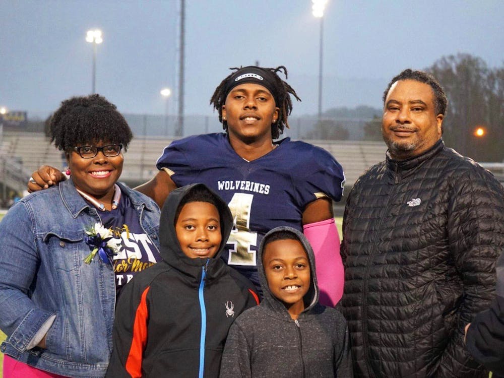 Mikhari Sibblis with his two brothers, mother, and father at West Forsyth High School. Sibblis went on to play at Lehigh University. Litisha Slibblis, photo provided