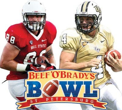 Ball State tight end Zane Fakes, right, pushes past Eastern Michingan Sophomore Kevin Johnson during their game Friday. DN PHOTO JONATHAN MIKSANEK