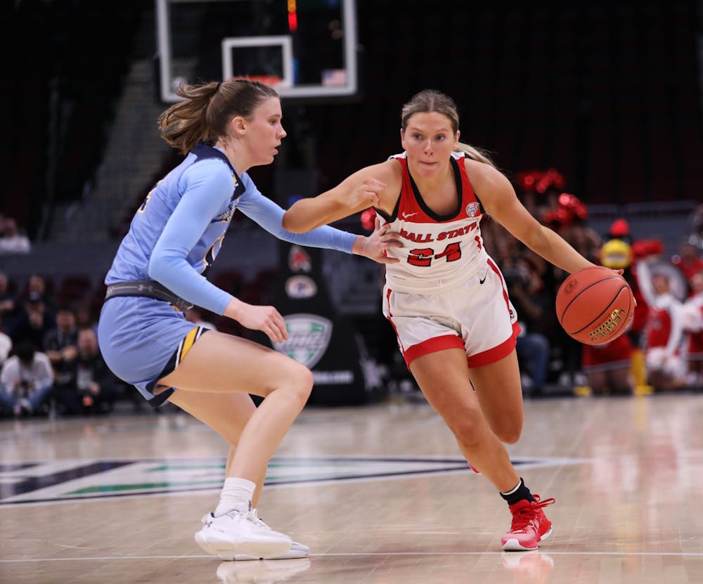 <p>Junior Madelyn Bischoff dribbles the ball down court against Kent State March 15 at Rocket Mortgage FieldHouse in Cleveland, Ohio. Bischoff scored 10 points in the game. Mya Cataline, DN</p>