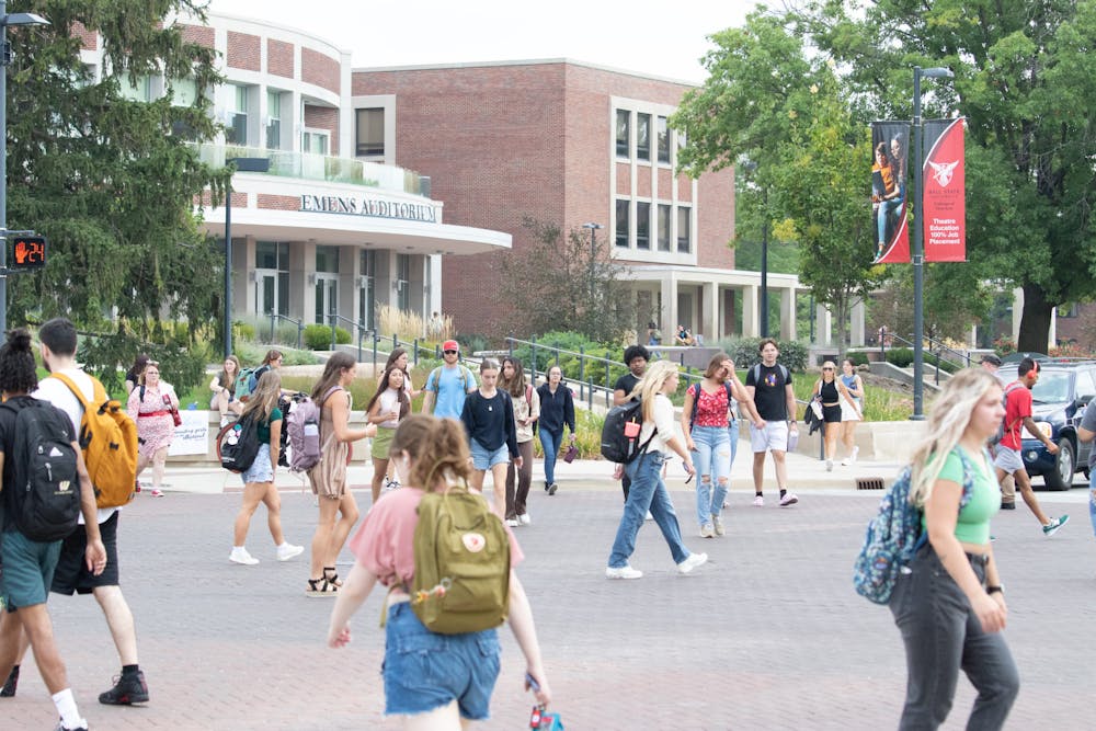 <p>Students walk through the Scramble Light on the first day of classes for the fall 2023 semester on August 22, 2023. Olivia Ground, DN </p>