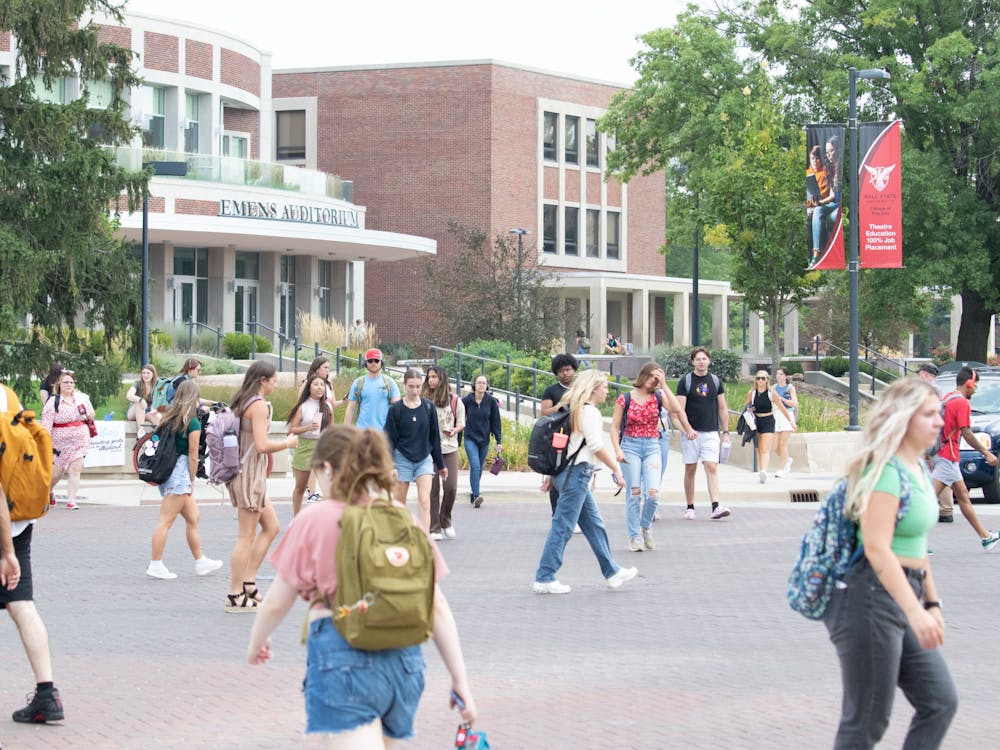 Students walk through the Scramble Light on the first day of classes for the fall 2023 semester on August 22, 2023. Olivia Ground, DN 