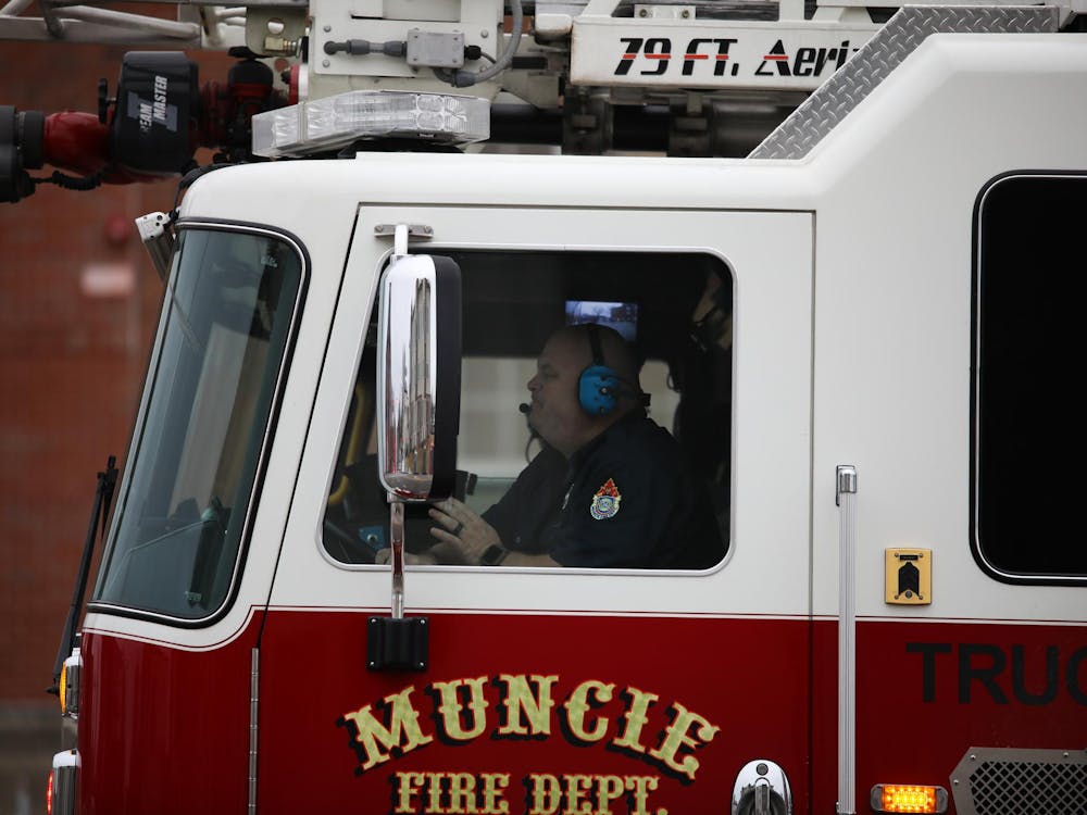 A Muncie Fire Department firefighter drives through Muncie in February 2024. During the holiday season, the Muncie Fire Department ramps up its annual Toys for Tots program, collecting and distributing toys to families in need across the community. Isabella Kemper, DN