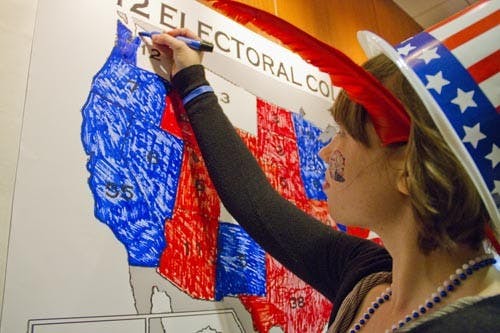 Callie Johnson, a freshman actuarial science and Japanese major, colors in an election map in DeHority Complex on Election Day. DeHority Complex’s watch party started at 9 p.m. and ran to midnight to allow students to watch the election results as they came in and participated in a variety of election-themed games. Students gathered at several locations on campus, including the L.A. Pittenger Student Center and DeHority Complex, to watch the results of the 2012 general election. The Department of Political Science hosted a watch party in the Student Center, allowing students and staff to interact with professors during the race. On Election Day, the Student Government Association helped fund a cooperative effort between College Republicans and University Democrats to sponsor shuttles that took students to and from polling places from 8 a.m. to 6 p.m. SGA President Chris Wilkey said 250 people utilized the shuttle. DN FILE PHOTO EMMA FLYNN