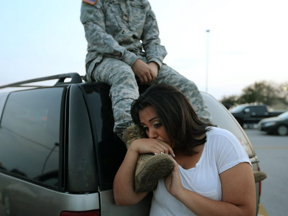 Lucy Hamlin and her husband, Spc. Timothy Hamlin, wait to get back to their home on the base following a shooting incident at Fort Hood, Texas, on Wednesday, April 2, 2014. (Deborah Cannon/Austin American-Statesman/MCT)