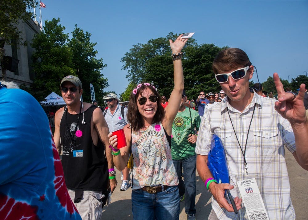 Vicky Hardest, 47, of Northbrook, Ill., makes her way in to the Grateful Dead concert at Soldier Field in Chicago on Friday, July 3, 2015. (Zbigniew Bzdak/Chicago Tribune/TNS)