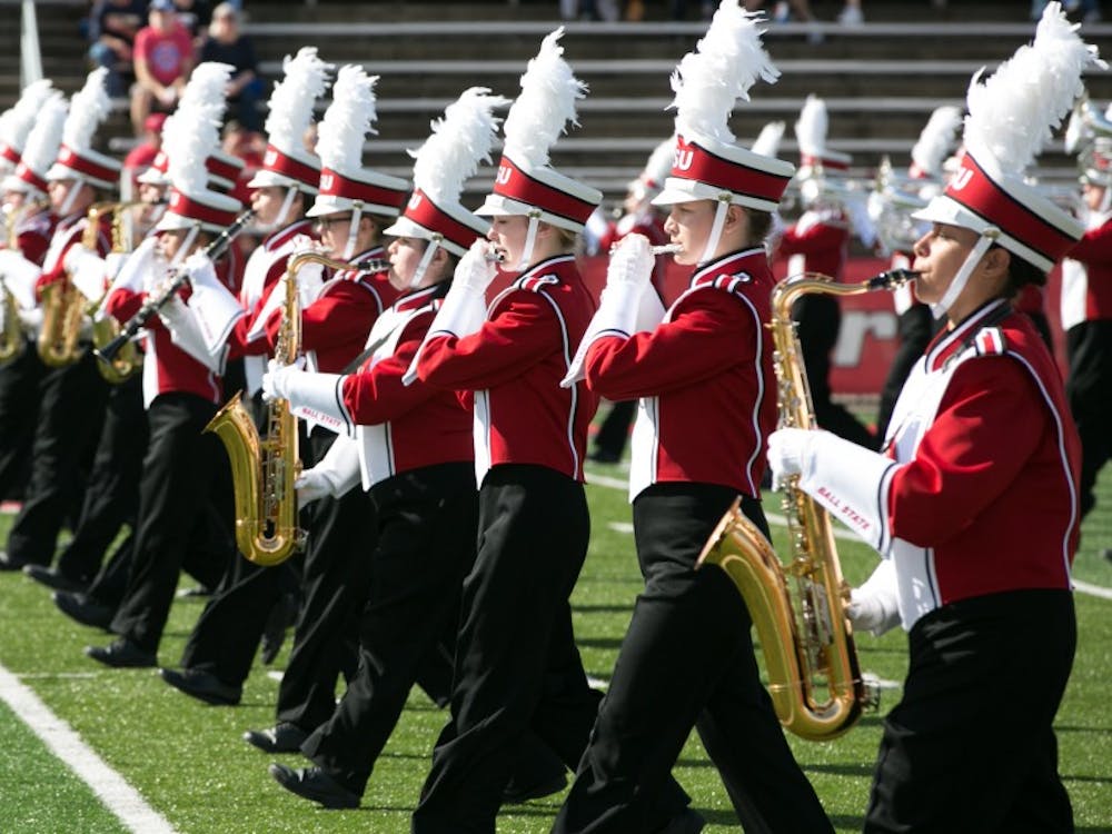 The Pride of Mid-America marching band performs the opener to the homecoming game on Oct. 21 against Central Michigan in Scheumann Stadium. The Cardinals had a hard loss of 56-9. Kaiti Sullivan, DN