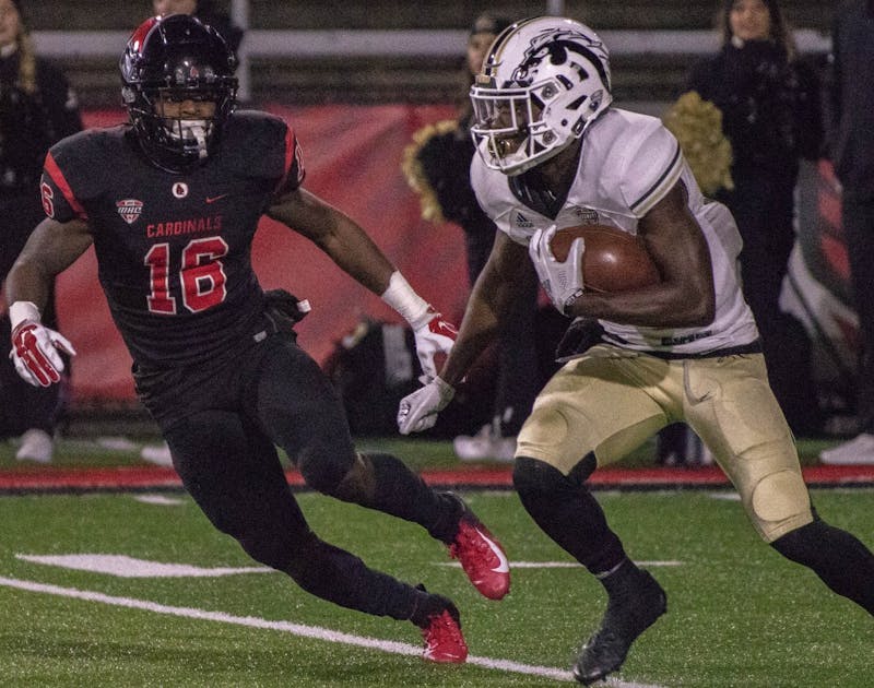 Ball State freshman defensive back Tyler Potts tracks Western Michigan's Justin Tranquill as he advances up the field in the first quarter of the football game Tuesday, Nov. 13 at Scheumann Stadium. The Cardinals won the game 42-41 in overtime. Sharpe L. Marshall,DN