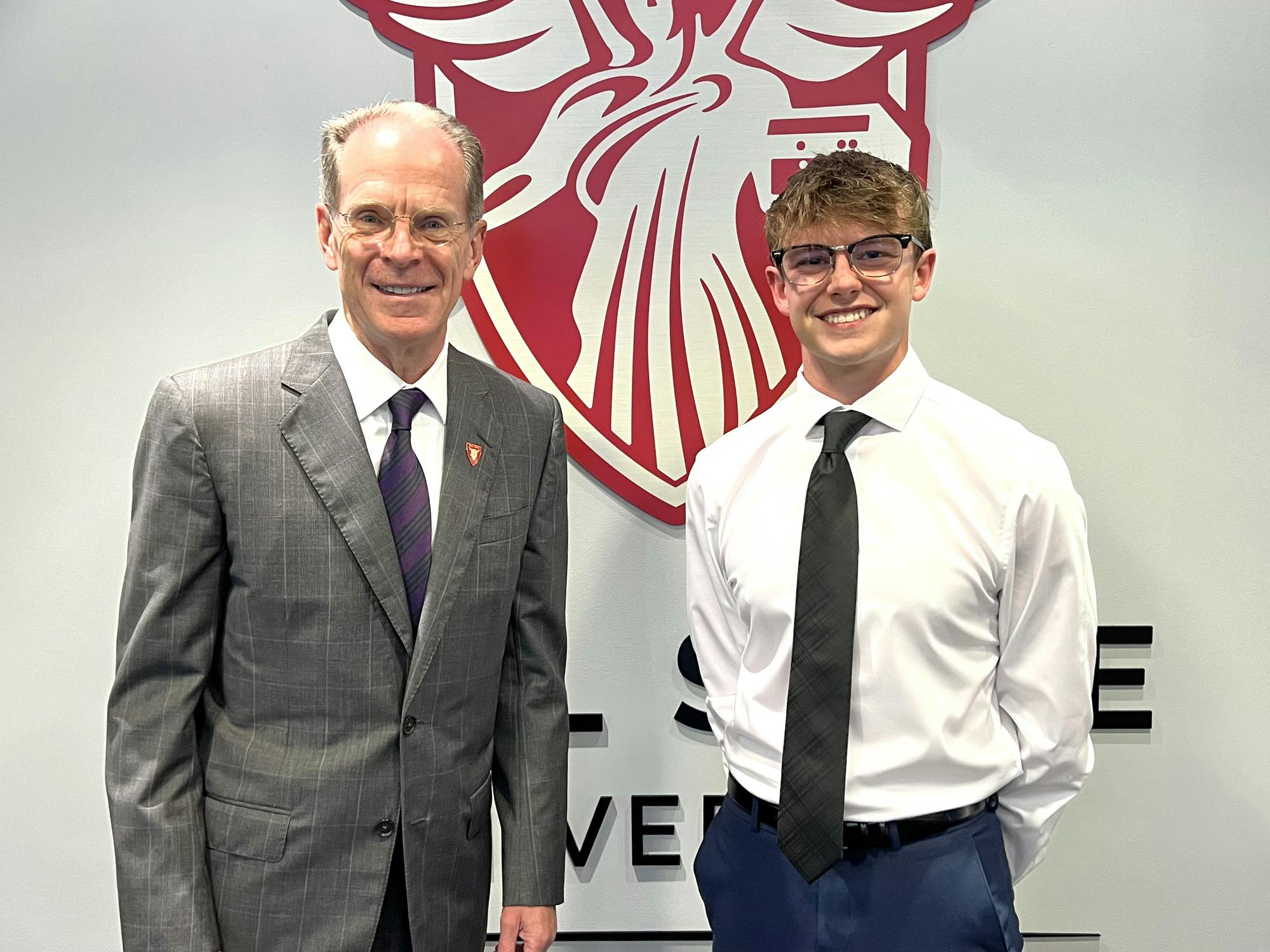 Aidan Davis poses for a photo with Geoffrey Mearns Aug. 12 on the first floor of the Administration Building. Davis hopes to bring the voice of the students to the board. Gail Wernew, Photo Provided