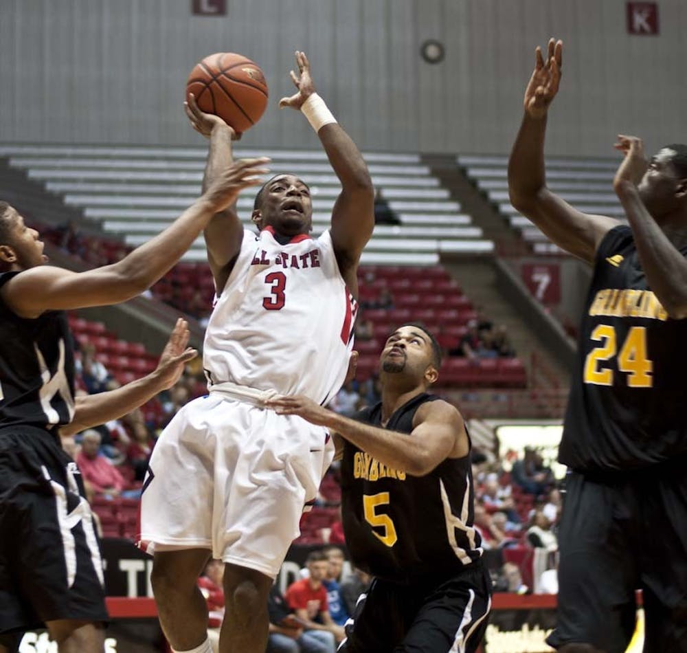 Freshman guard Marcus Posley attempts to push past the Grambling defense for the lay up attempt. DN PHOTO JONATHAN MIKSANEK