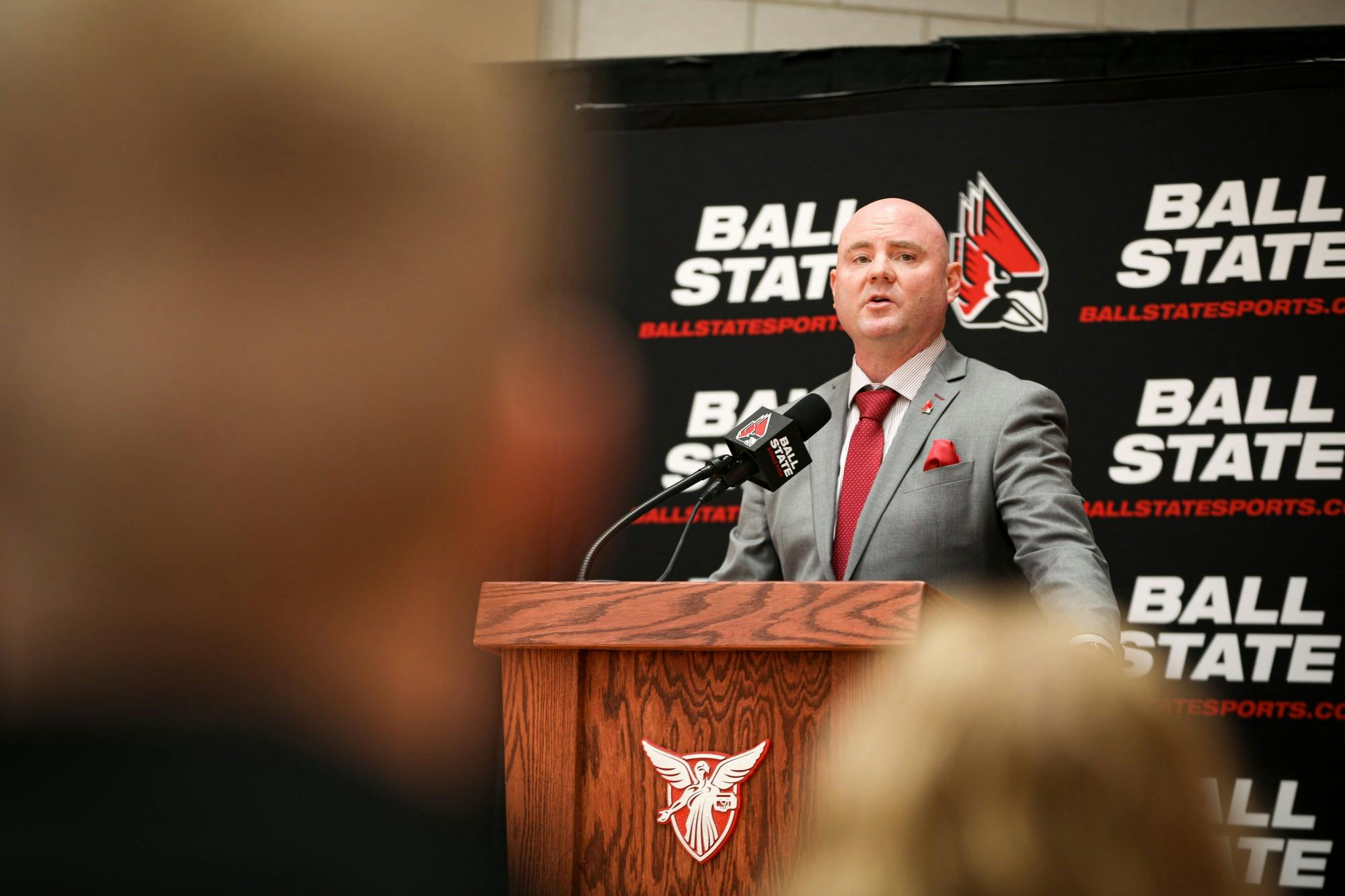 Head men's basketball coach Michael Lewis speaks to a crowd at a press conference Apr. 6 in the Dr. Don Shondell Practice Facility. Athletic Director Beth Goetz presented a ball in honor of the new coach. Jacy Bradley, DN