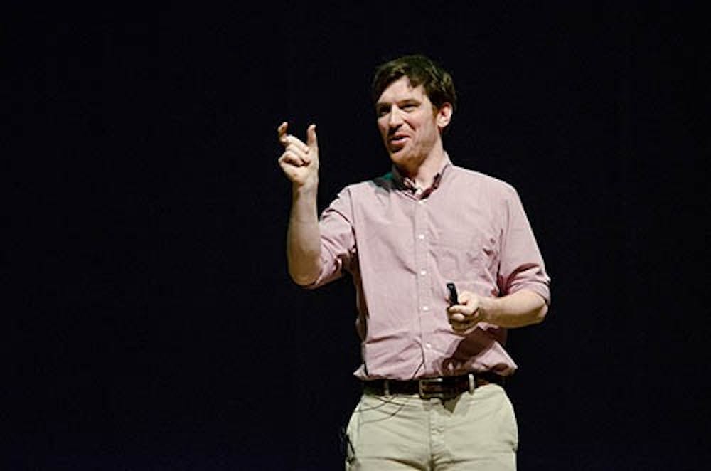 Author Conor Grennan speaks to the freshmen at a convocation held to talk about his book, “Little Princes.” Grennan spoke of his travels and of his time in the orphanage where he had a hard time understanding the children at first. DN PHOTO BREANNA DAUGHERTY 