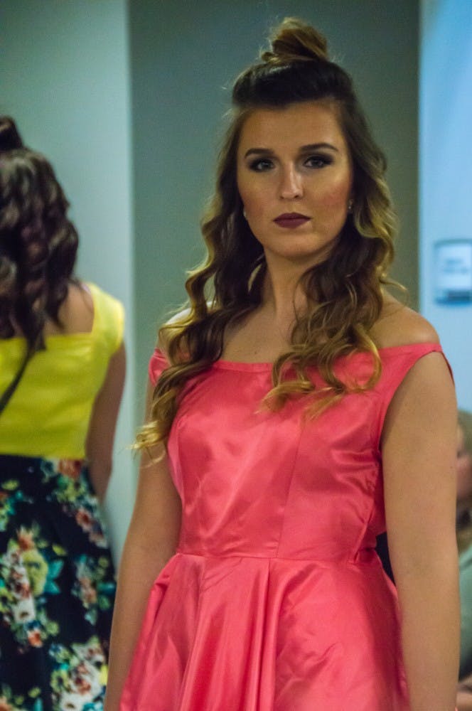 Family and friends watched the Fashion Design Soceity host a fashion show on April 1 in the Applied Technology Building. Since 1997, the organization helps fashion students develop their skills. Teri Lightning Jr., DN