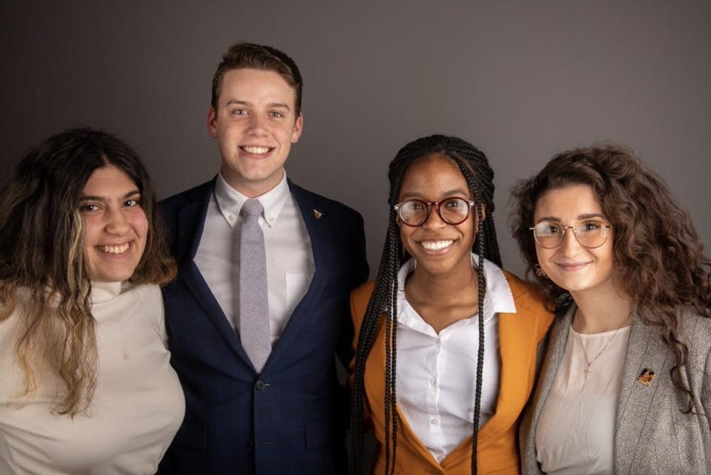 <p>Bold executive slate members pose for a photo in February 2020. (Left to right) Amanda Mustaklem, treasurer, Connor Sanburn, president, Jordyn Blythe, vice president and Gina Esposito, chief administrator. Bold was the Student Government Association executive slate during the 2020-21 school year. <strong>Jacob Musselman, DN File</strong></p>