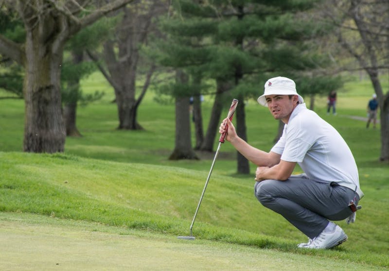 Junior Timothy Wiseman studies the green before putting at hole 11 during the Earl Yestingsmeier Memorial Invitational on April 14 at the Deleware Country Club. The Cardinals played at ODU/OBX Intercollegiate in North Carolina Oct. 22-24. Kaiti Sullivan, DN File