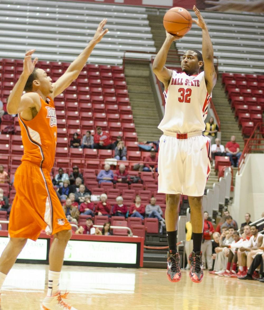 Senior guard Jesse Berry shoots a three-pointer over a Bowling Green player on Feb. 15 at Worthen Arena. Berry broke the Ball State school record for most three-pointers in a career with 206. DN PHOTO BREANNA DAUGHERTY 