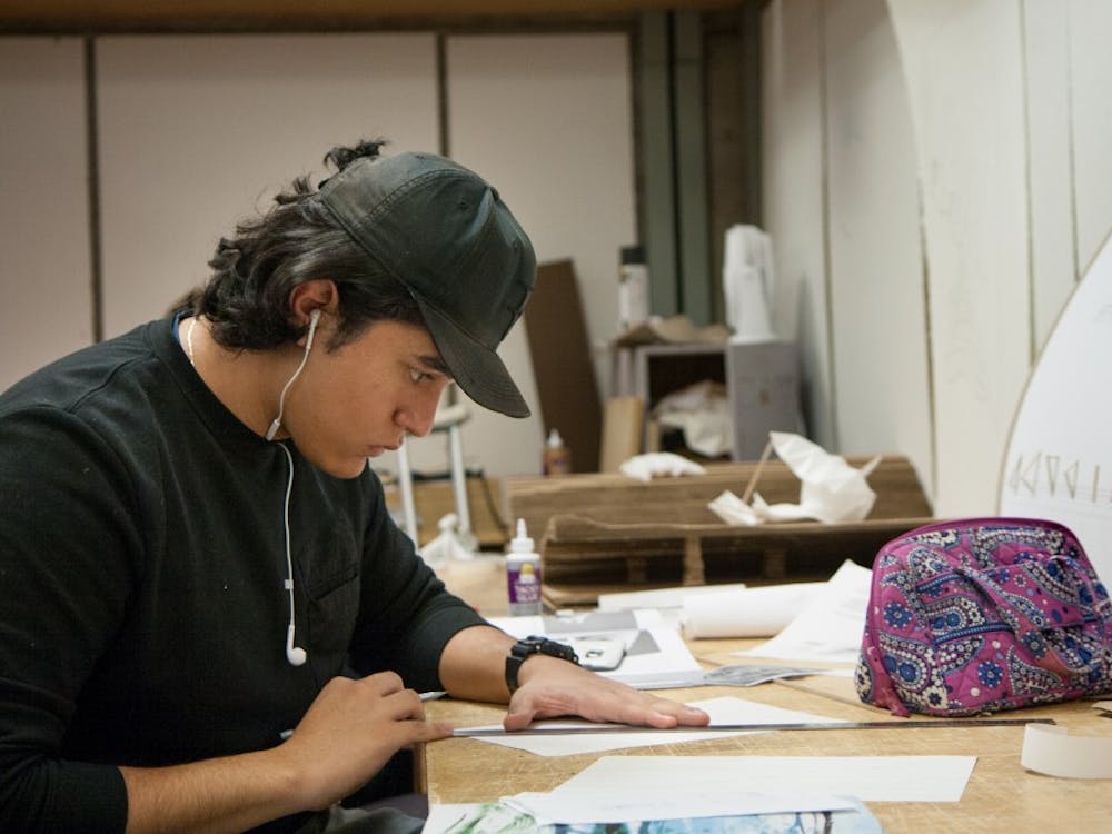 Sophomore architecture major Favian Ceruantes works on a class project in s studio on the 5th floor of the CAP building. Each CAP student has their own work space. Kaiti Sullivan, DN