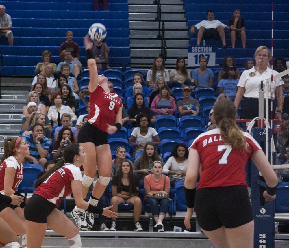 Junior outside hitter Sabrina Mangapora slams the ball over the net for a kill. She is one of the few veterans on a Cardinals roster loaded with underclassmen. COLIN GRYLLS//DN