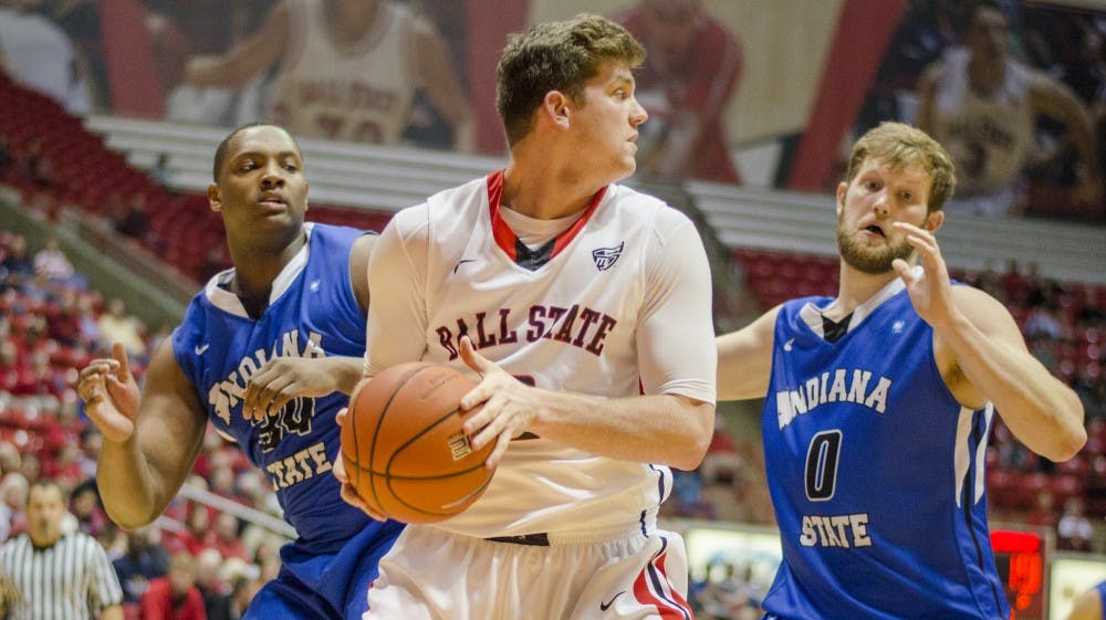 Senior center Matt Kamieniecki attempts to keep the ball away from Indiana State players during the game on Dec. 6 at Worthen Arena. DN PHOTO BREANNA DAUGHERTY