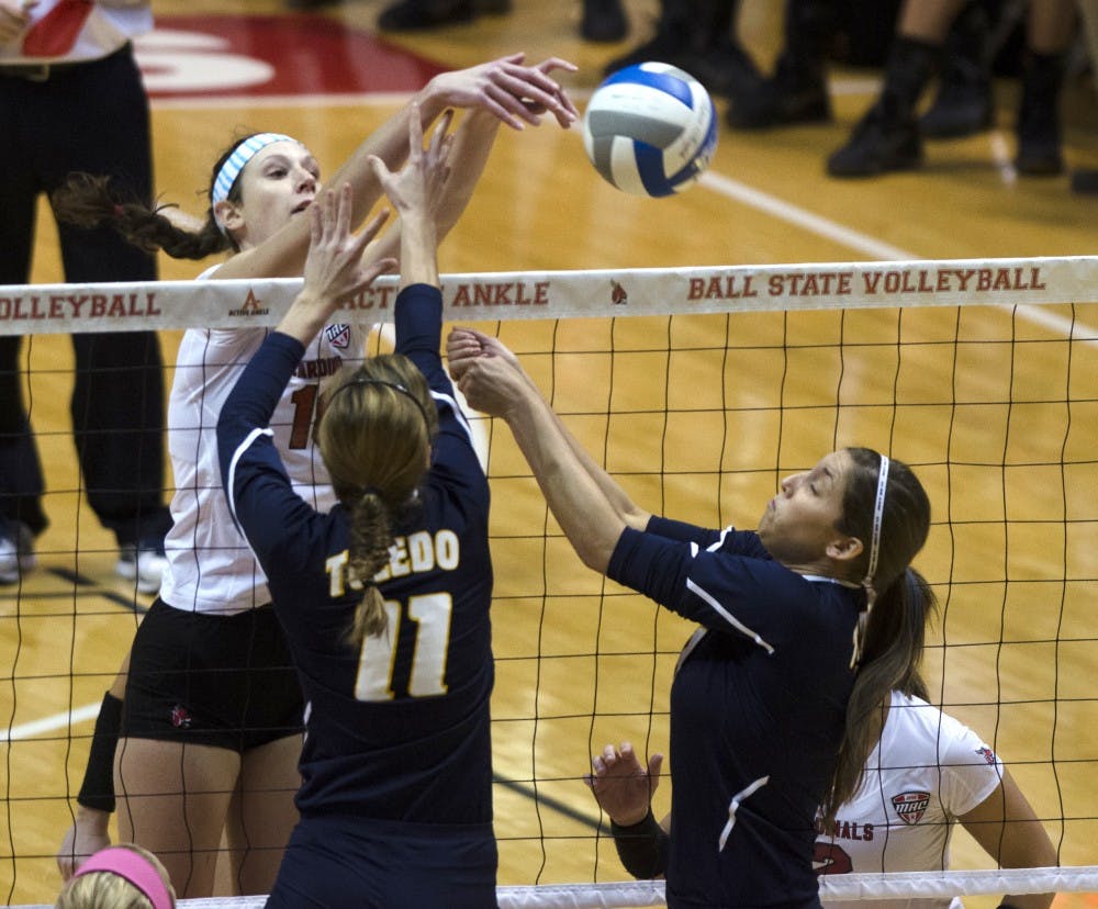 Redshirt sophomore middle blocker Hayley Benson knocks the ball over the net for a kill against the University of Toledo on Nov. 7 at Worthen Arena. Benson had 17 kills in the loss. DN PHOTO BREANNA DAUGHERTY 