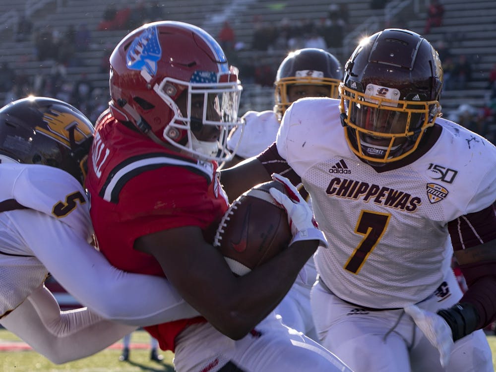 Junior wide receiver Justin Hall gets tackled by Central Michigan players during the game Nov. 16, 2019, at Scheumann Stadium. Hall had two touchdowns in the game. Rebecca Slezak, DN
