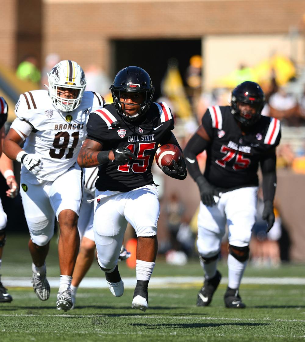 <p>Red shirt junior running back Marquez Cooper runs the ball against Western Michigan Sept. 30 at Waldo Stadium in Kalamazoo, Michigan. Cooper received a total of 82 yards in the game. Mya Cataline, DN</p>