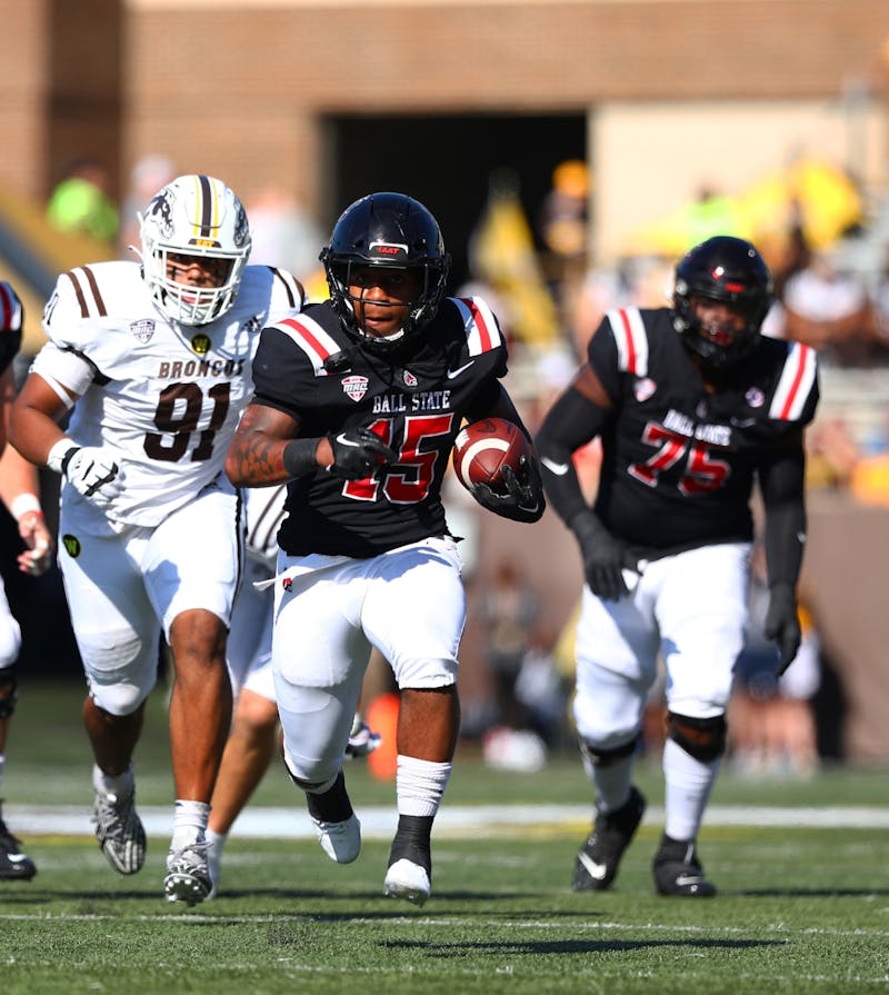 Red shirt junior running back Marquez Cooper runs the ball against Western Michigan Sept. 30 at Waldo Stadium in Kalamazoo, Michigan. Cooper received a total of 82 yards in the game. Mya Cataline, DN