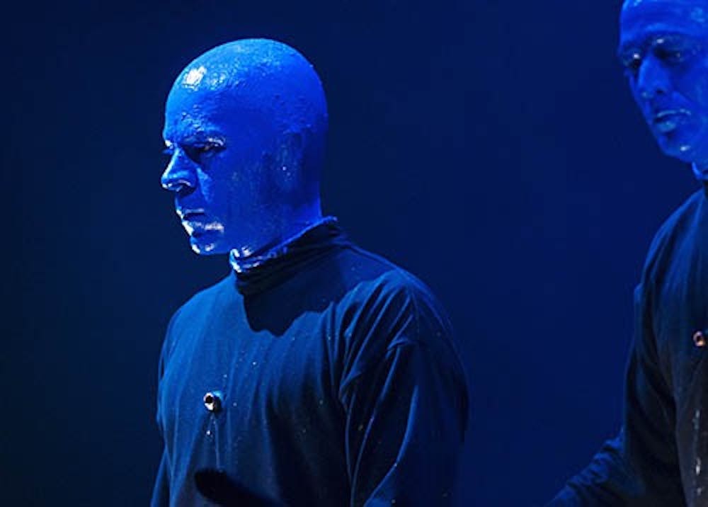 Blue Man Q&A - Russell Rinker of the Blue Man Group looks out on the audience in John R. Emens Auditorium during a break in the music on Tuesday. Rinker has been an off-and-on member of the show for 10 years. This is his first national tour. DN FILE PHOTO BOBBY ELLIS