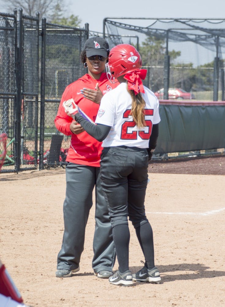 Sophomore outfielder talks to head coach Tyra Perry during the first game of the double header against Western Kentucky at First Merchants Ballpark Complex on March 21. DN PHOTO ALAINA JAYE HALSEY