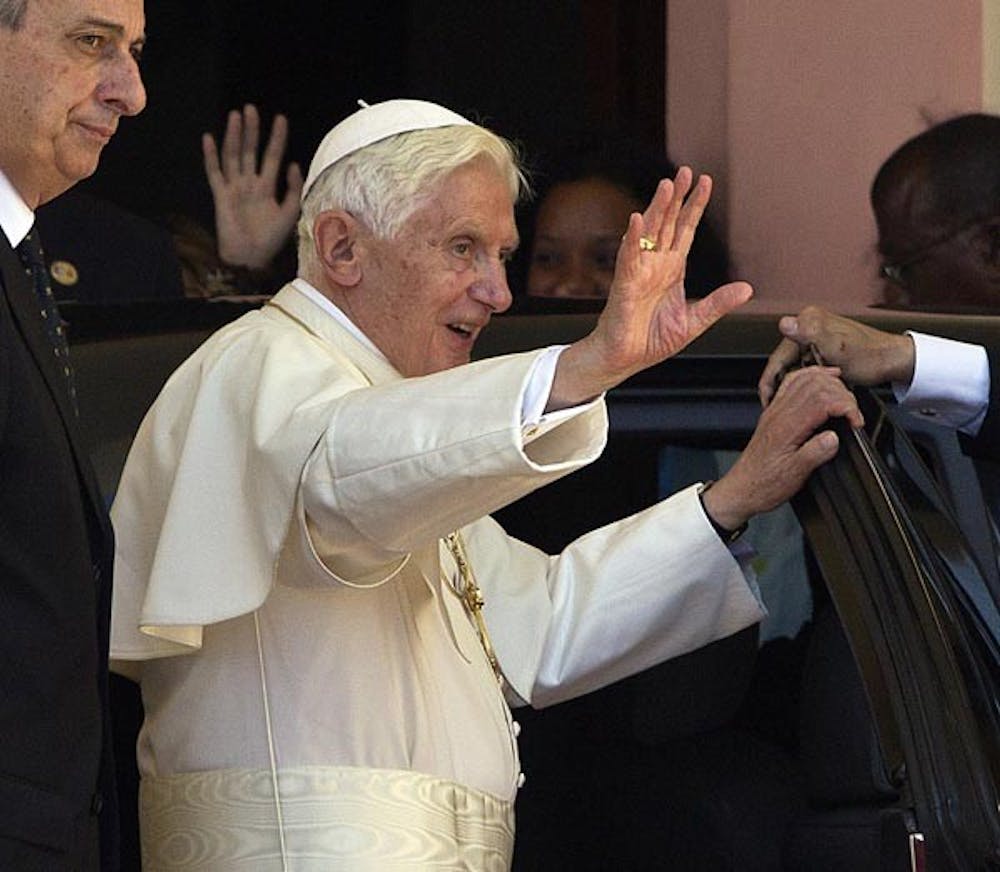 Pope Benedict XVI waves farewell to the folks of Santiago de Cuba on the steps leading up to the original statue of Our Lady of Charity, located in the Sanctuary of El Cobre on Tuesday, March 27, 2012. (Patrick Farrell/Miami Herald/MCT)