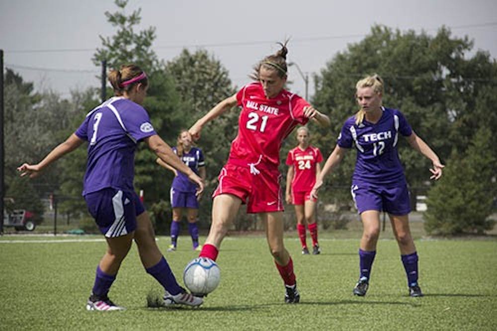 Defender Victoria Jacobs, junior, tries to steal the ball from her opponent during the game against Tennessee Tech on Sept. 8th, 2013. Ball State won 2-0. DN PHOTO EMMA ROGERS