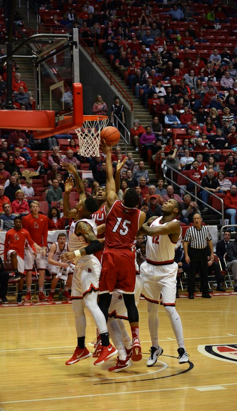 The men's basketball attempts to keep the rebound away from Northern Illinois during the game on Feb 19 in Worthen Arena. DN PHOTO KORINA VALENZUELA