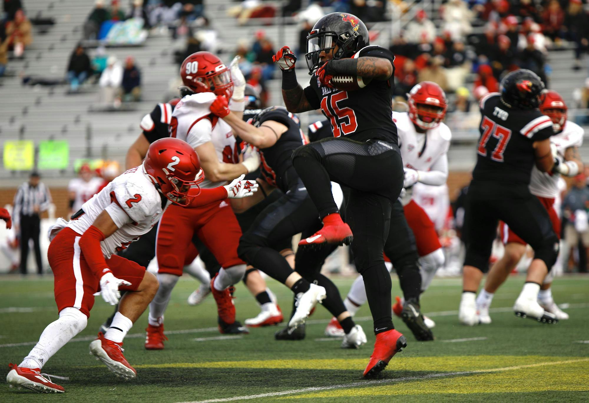 Redshirt junior running back Marquez Cooper attempts to jump over the defense against Miami Nov. 25 at Scheumann Stadium. Andrew Berger, DN