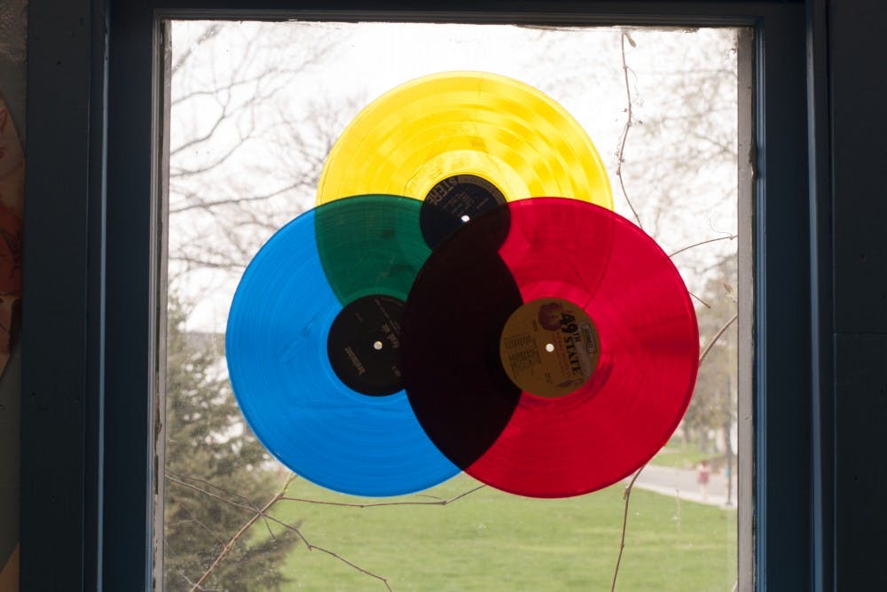 Owner of Village Green Records Travis Harvey bought customers who waited early outside of the store donughts. Some customers arrived earlier than eight o'clock in the morning to wait in line to buy vinyl. DN PHOTO JASON CONERLY