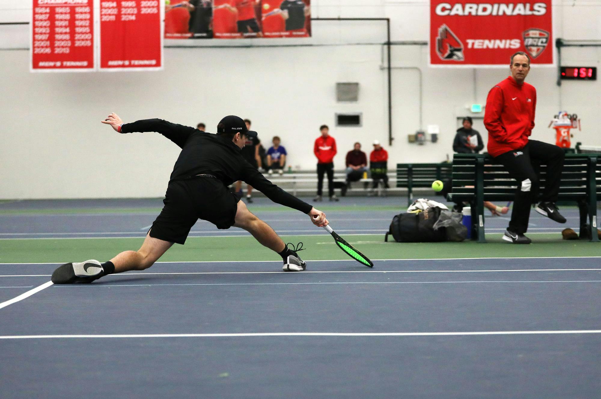 Freshman Drew Hayward hits the ball against Eastern Illinois Jan. 20 at the Muncie YMCA. Mya Cataline, DN