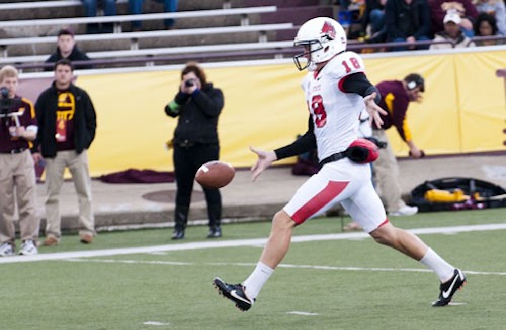 Senior punter Scott Kovanda punts the ball away against Central Michigan. Kovanda has been invited to the 2013 NFL combine. DN FILE PHOTO BOBBY ELLIS