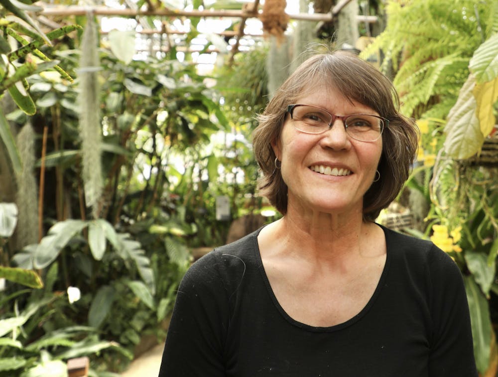 Greenhouse Curator Cheryl LeBlanc poses for a photo April 23, 2021, in the Rinard Orchid Greenhouse. LeBlanc curates the largest university-based orchid collection in the country. Rylan Capper, DN