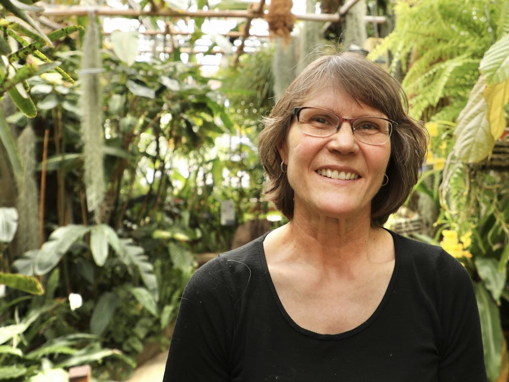 Greenhouse Curator Cheryl LeBlanc poses for a photo April 23, 2021, in the Rinard Orchid Greenhouse. LeBlanc curates the largest university-based orchid collection in the country. Rylan Capper, DN
