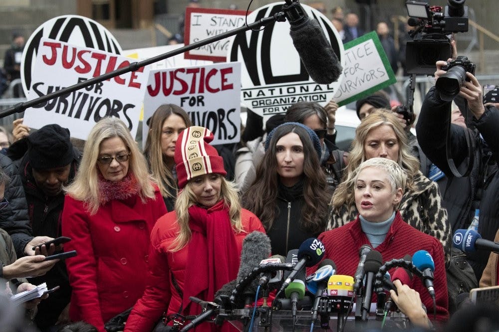 <p>Actor Rose McGowan, right, speaks at a news conference as actor Rosanna Arquette, center left, listens outside a Manhattan courthouse after the arrival of Harvey Weinstein, Jan. 6, 2020, in New York. Weinstein and several women who have accused him of sexual misconduct converged at the New York City courthouse ahead of his trial on charges of rape and sexual assault. <strong>(AP Photo/Mark Lennihan)</strong></p>