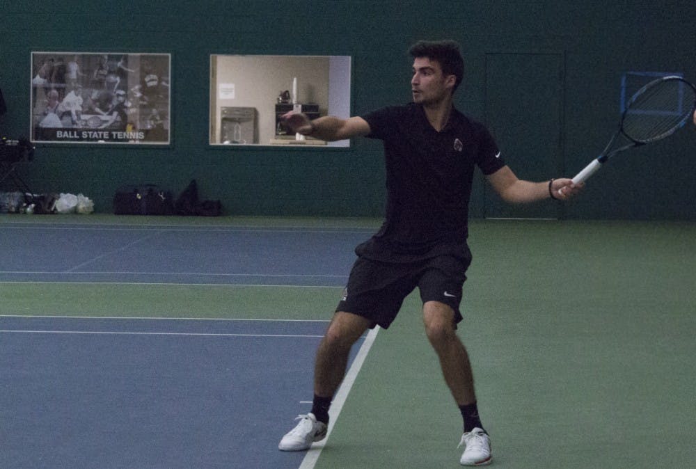 <p>Ball State men’s tennis player Marko Guzina prepares to return the ball during a singles set against Eastern Illinois University on Jan. 20 at the Northwest YMCA of Muncie. Guzina won his set. <strong>Briana Hale, DN</strong></p>