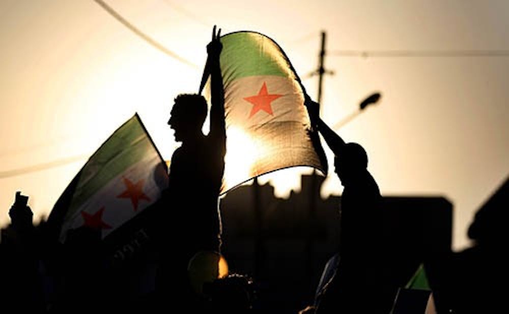 Syrian protesters rally to condemn the alleged poison gas attack on the suburbs of Damascus, in front of the Syrian embassy in Amman, Jordan on Friday, August 23, 2013. (Mohammad Abu Ghosh/Xinhua/Zuma Press/MCT)