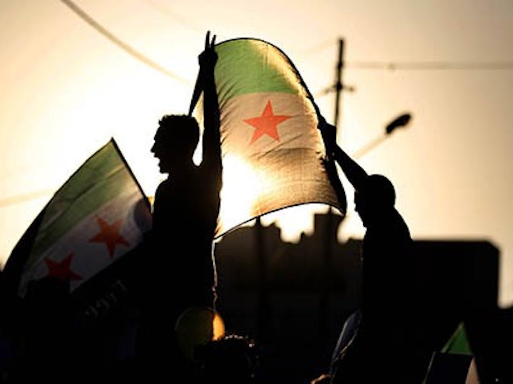 Syrian protesters rally to condemn the alleged poison gas attack on the suburbs of Damascus, in front of the Syrian embassy in Amman, Jordan on Friday, August 23, 2013. (Mohammad Abu Ghosh/Xinhua/Zuma Press/MCT)
