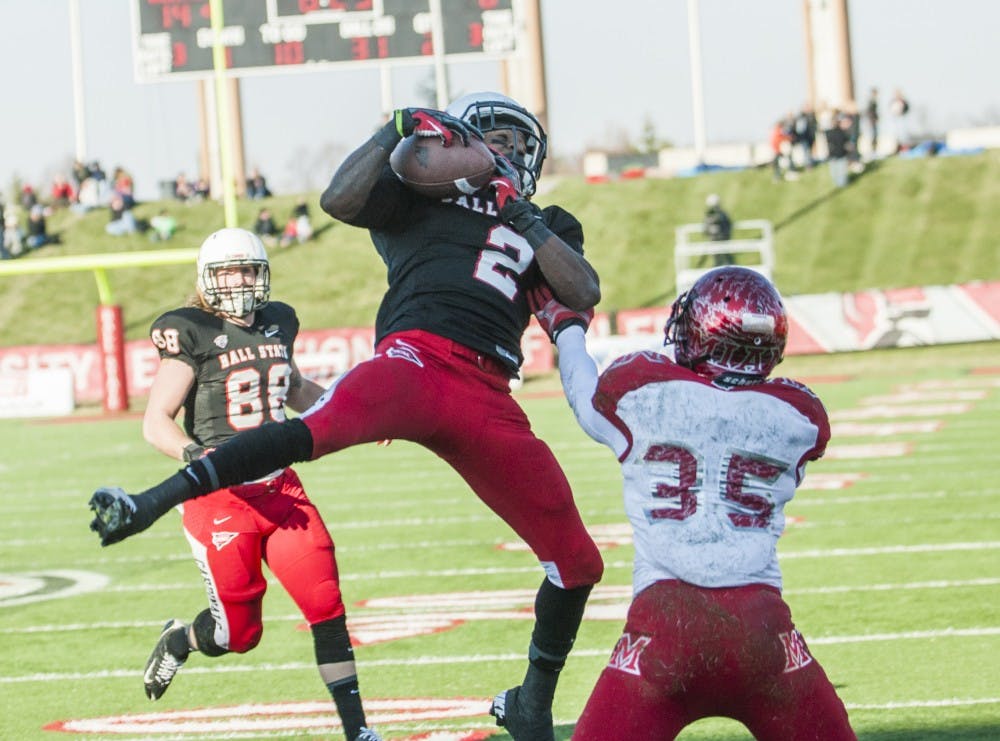 Senior wide receiver Jamill Smith makes a catch in the end zone during the first half of the game against Miami on Nov. 29. DN PHOTO JONATHAN MIKSANEK