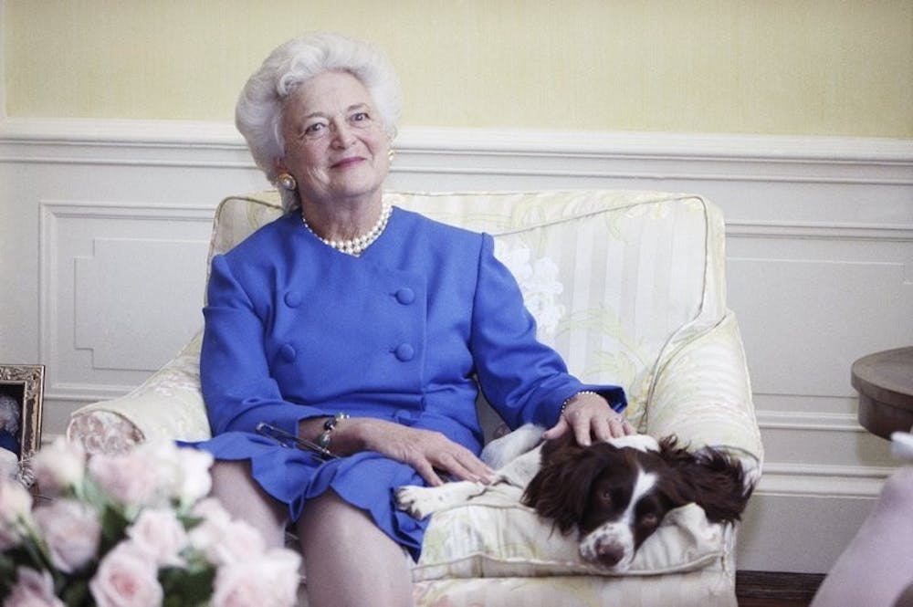 In this 1990 file photo, first lady Barbara Bush poses with her dog Millie in Washington. A family spokesman said Tuesday, April 17, 2018, that former first lady Barbara Bush has died at the age of 92. AP Photo