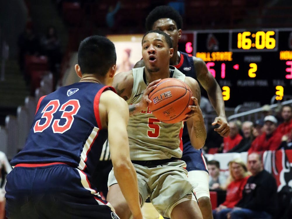 Ball State junior guard Ishmael El-Amin moves the ball in while being guarded by Howard freshman guard Ian Lee during the Cardinals' game against the Bison Saturday, Nov. 23, 2019, at John E. Worthen Arena. Ball State won 100-69. Paige Grider, DN