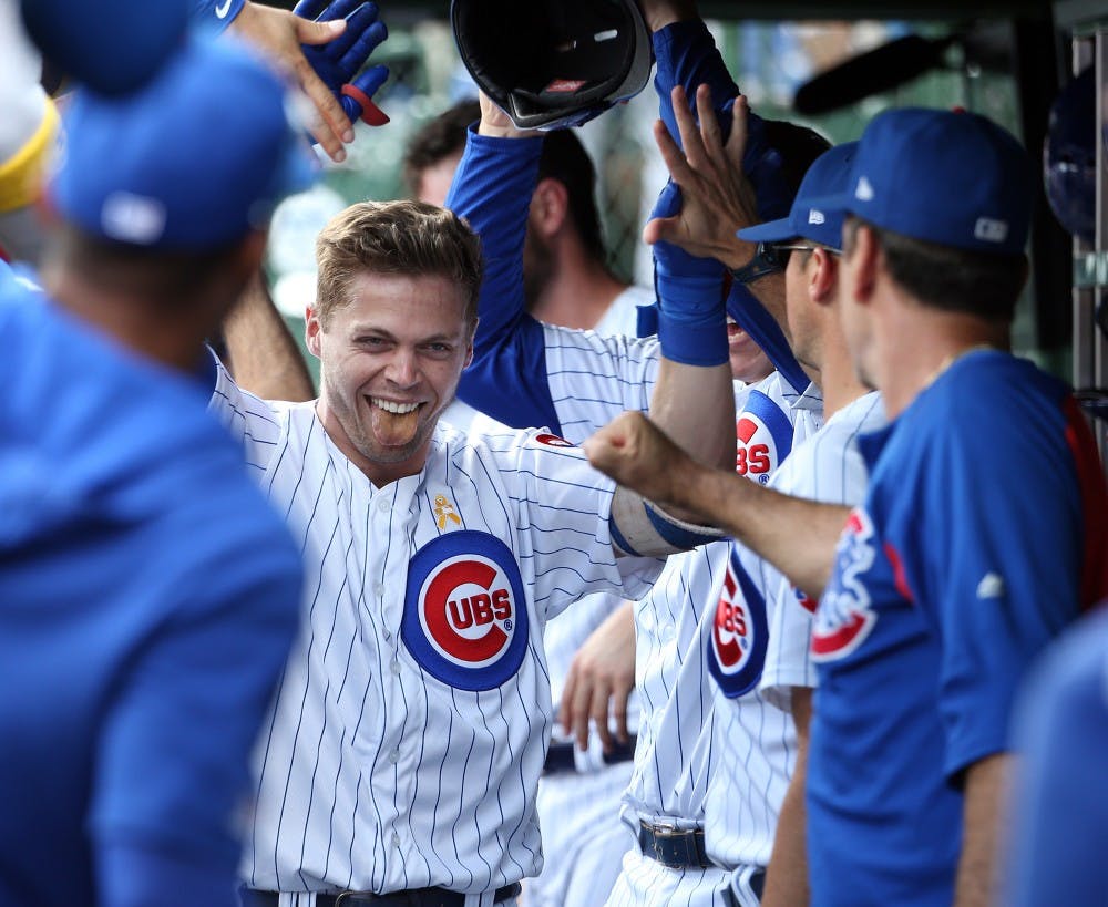 Chicago Cubs shortstop Nico Hoerner (2) is congratulated after hitting a home run in the first inning against the Pittsburgh Pirates on Friday, Sept. 13, 2019 at Wrigley Field in Chicago, Ill. (Terrence Antonio James/Chicago Tribune/TNS)