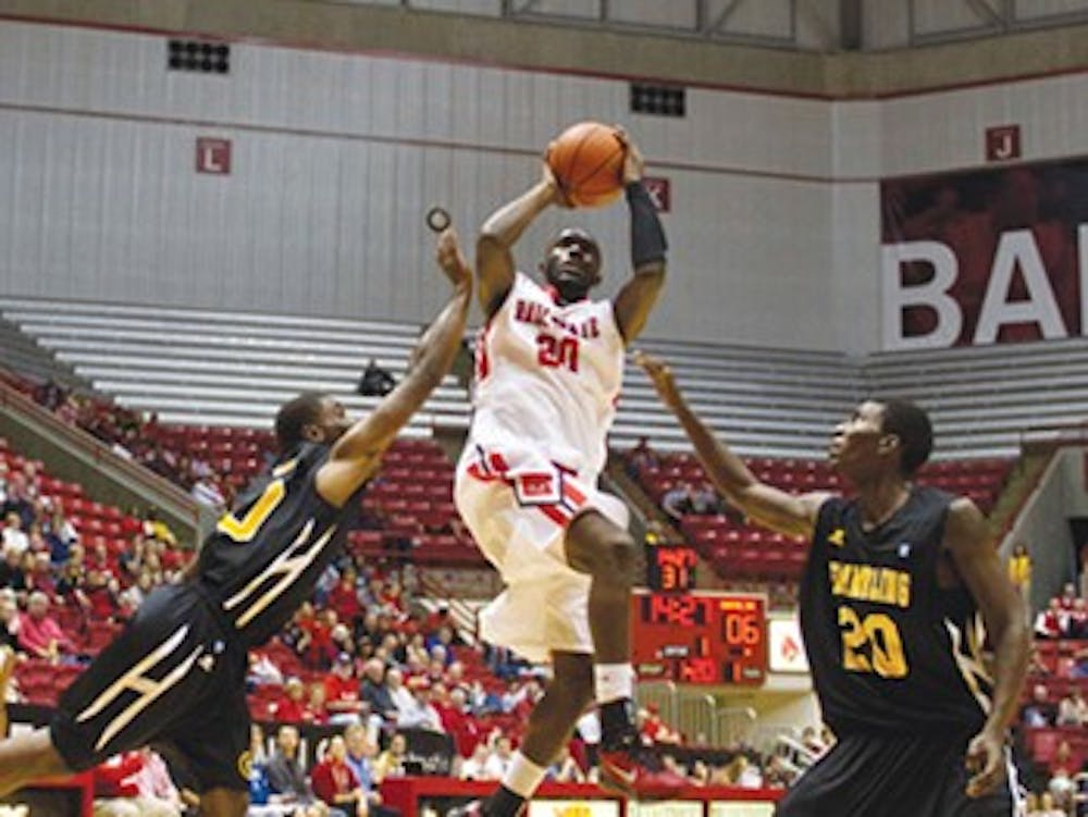 Chris Bond attempts te shot in the first half of the game on Nov. 11., while Rose Terry and another Grambling State defender attempt to block. Chris Bond's on ball defense has led 4.5 steals per game. DN FILE PHOTO EMMA FLYNN