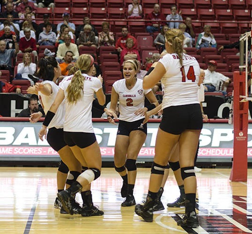 The team celebrates with junior outside hitter Alex Fuelling after she got a kill against the IUPUI Jaguars Sept. 17 at Worthen Arena. The women’s volleyball team went on to win 3-0. DN PHOTO BREANNA DAUGHERTY