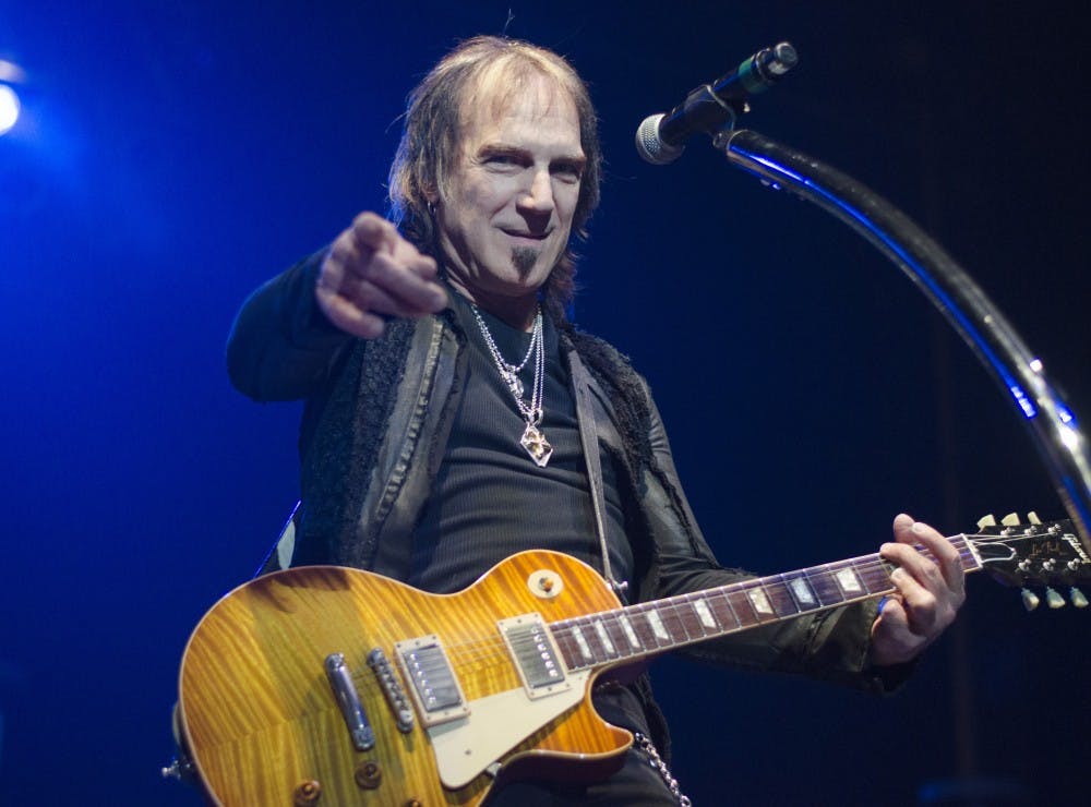 Dave Amato plays lead guitar during the song "Take it on the Run" Feb. 7 at John R. Emens Auditorium. Amato is the lead guitar and vocals for REO Speedwagon. DN PHOTO BREANNA DAUGHERTY