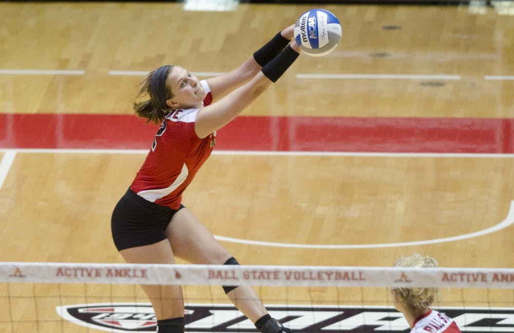 Junior outside hitter Alex Fuelling bumps the ball during the second set against Purdue University during a scrimmage March 29 at Worthen Arena. DN PHOTO BREANNA DAUGHERTY 