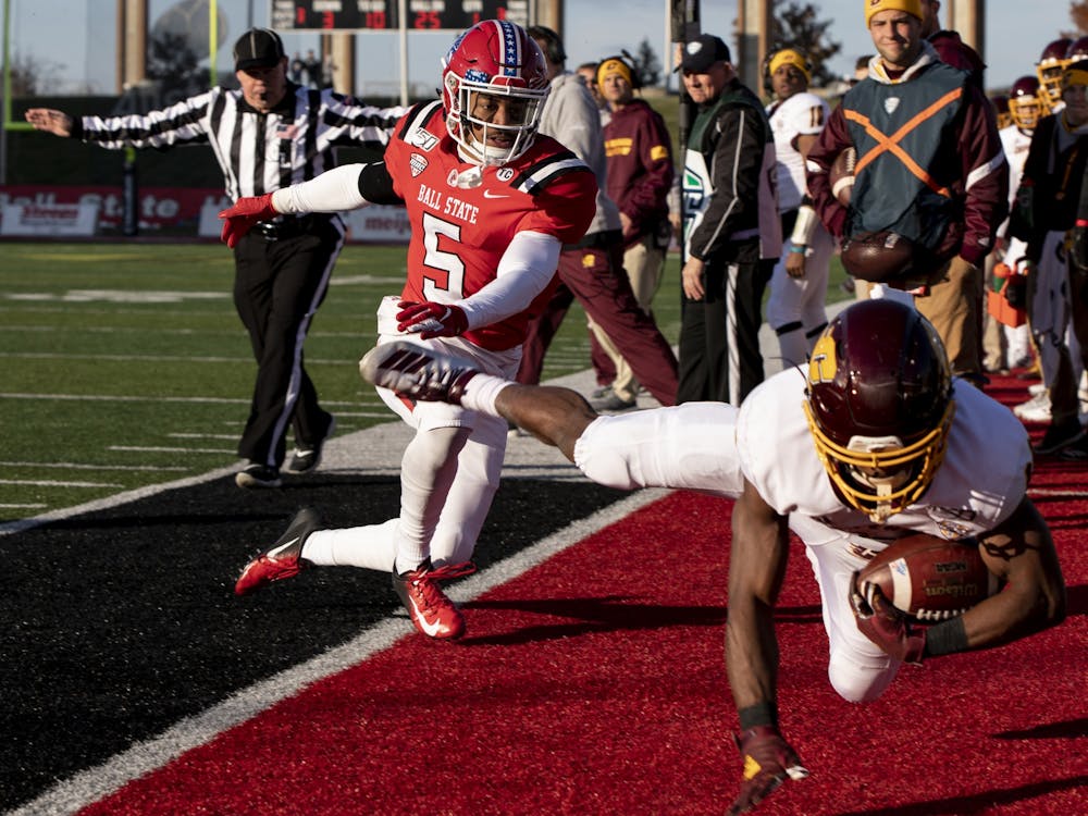 Central Michigan's Kalil Pimpleton runs the ball off the field to avoid a tackle from Ball State junior safety Bryce Cosby Nov. 16, 2019, at Scheumann Stadium. Cosby finished the game with five tackles and two pass breakups. Rebecca Slezak, DN